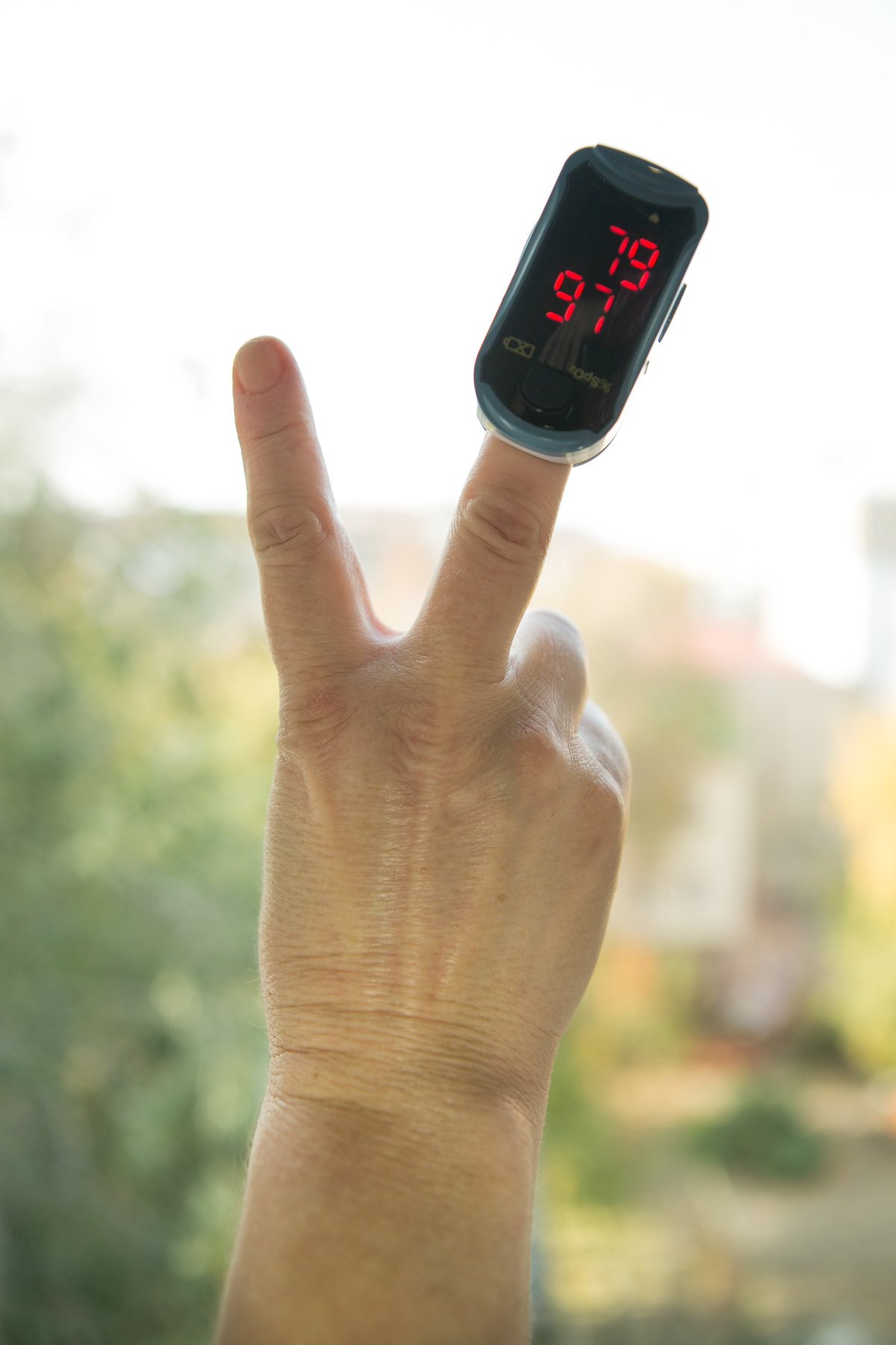 Blood oxygen saturation pulse oximeter on finger
