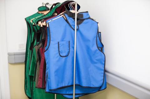 Rack of lead aprons used for x-ray protection in operating room, hospital