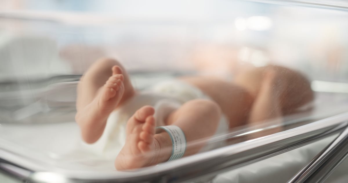 Cute Little Caucasian Newborn Baby Lying in Bassinet in a Maternity Hospital