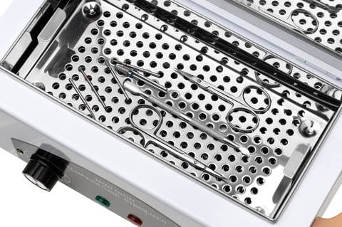 Electric sterilizer for medical devices on a white background