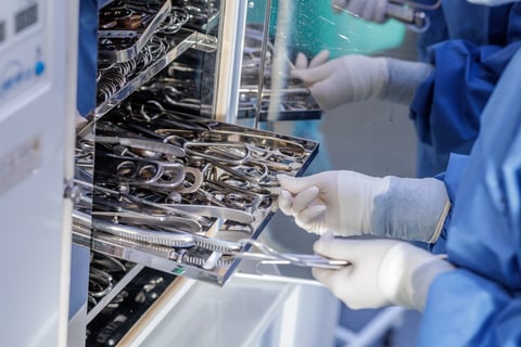 Stainless steel surgical scissors on sterilization rack