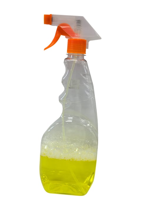 Yellow glass cleaner spray bottle without label isolated on white background