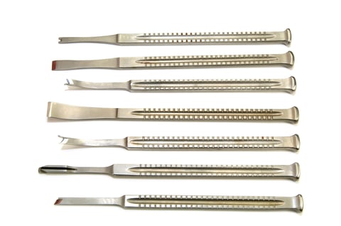 new metal surgical instruments on white background
