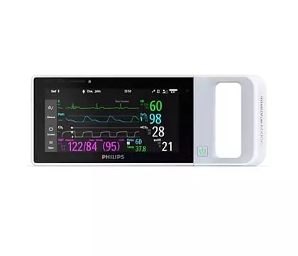 Philips portable patient monitor displaying vital signs including heart rate, SpO2, temperature, and blood pressure readings on a color screen