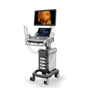 Medical ultrasound machine on wheeled cart with display screen showing ultrasound imaging