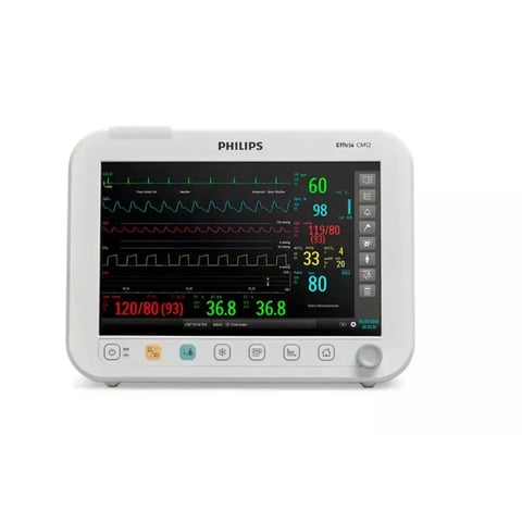 Philips Efficia CM2 patient monitor displaying vital signs including heart rate, blood pressure, temperature, and oxygen saturation on a multicolor waveform display