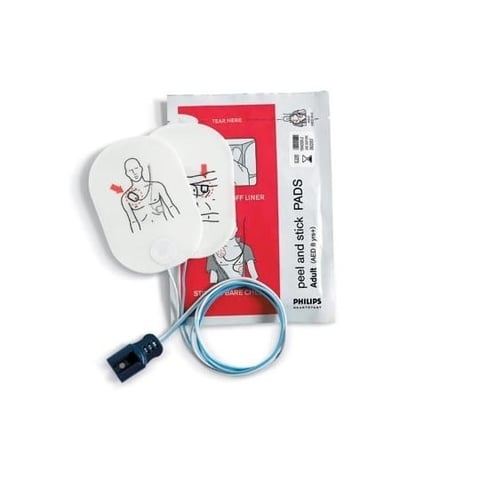 Philips defibrillator pads with instruction diagram and blue cable, showing adult CPR electrode placement