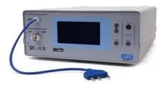 Desktop electronic testing equipment with blue display screen and control buttons connected to blue power cable