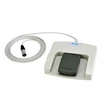 Digital blood pressure monitor with white cuff and attached tubing for measuring arterial pressure