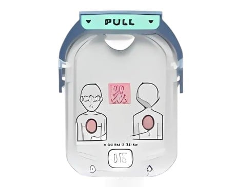AED defibrillator device with instructional icons showing electrode pad placement on chest and pull tab at top