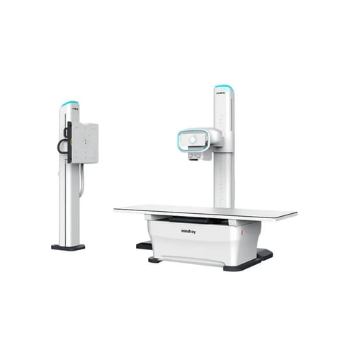 Digital X-ray imaging system with control panel on left and imaging table with overhead arm on right