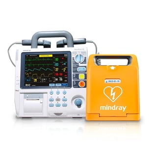 Medical defibrillator and cardiac monitor equipment set with white monitor unit and orange Mindray AED device