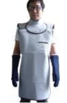 Person wearing a light gray protective vest with dark trim and blue sleeves, standing against a white background