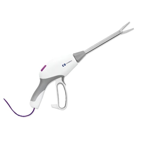 Instrumento quirúrgico con mango gris y blanco, accesorio metálico en forma de horquilla y cable morado
