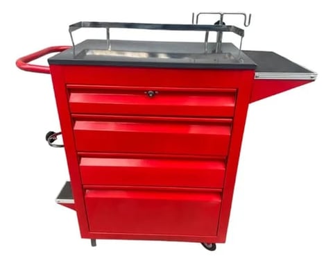 Red tool chest with drawers, metal work surface top, and curved handle on wheels