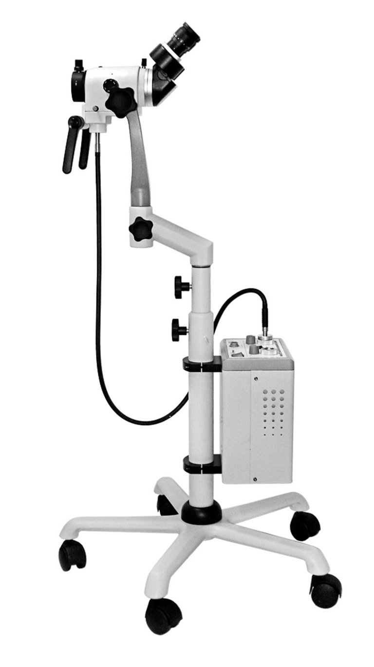 Dental microscope on mobile stand with articulating arm, binocular eyepieces, and control panel on wheeled base