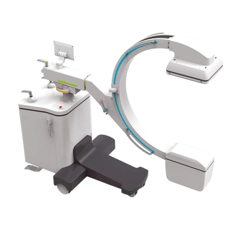 Medical imaging equipment showing C-arm X-ray system with gray components, control console, and patient positioning table