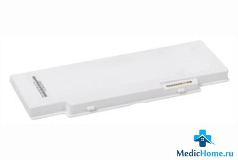 White rectangular battery pack with gold connector terminals on light background