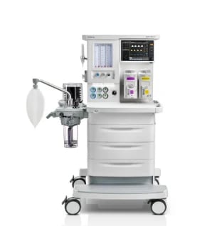 Medical anesthesia machine with monitors, controls, and supply drawers on wheeled cart