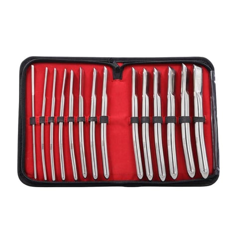 Set of dental instruments with metal picks and hooks arranged in red fabric case with black border