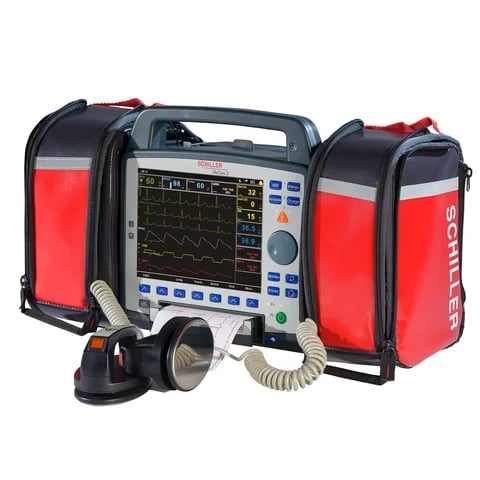 Portable defibrillator monitor with red carrying cases and external pacing cables