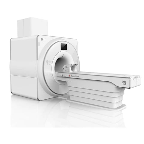 White medical CT scan machine with patient table on white background