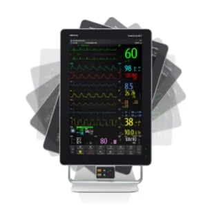 Medical monitor display showing patient vital signs including heart rate, oxygen saturation, and other health metrics on screen