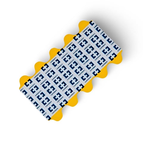Yellow and white numbered cattle ear tags arranged in rows displaying sequential numbers for livestock identification