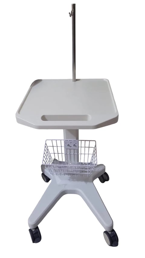 Mobile medical cart with white work surface, metal basket, vertical pole, and black caster wheels on white background