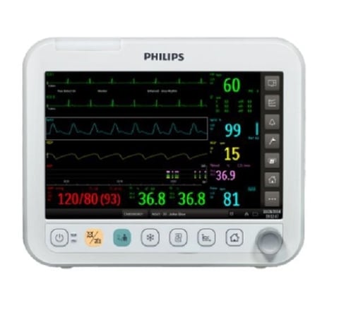 Philips patient monitor displaying vital signs including heart rate, blood pressure, oxygen saturation, and temperature readings