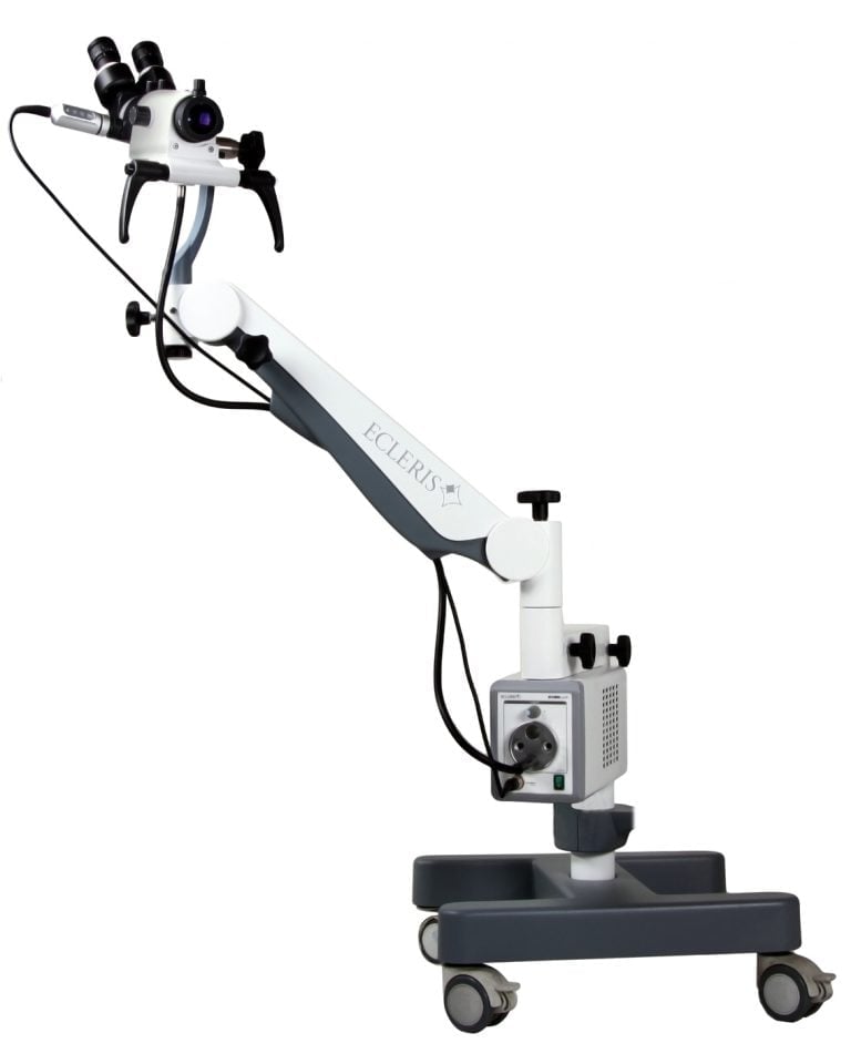 Surgical microscope on wheeled stand with binocular eyepieces and articulated arm