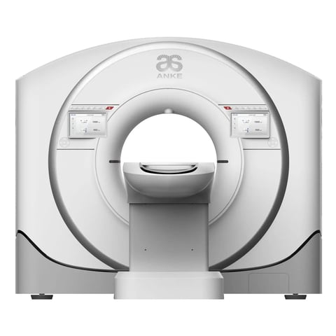 White medical CT scanner machine with circular gantry opening and control panels, front view