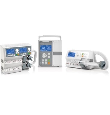 Three medical infusion pumps and IV delivery systems arranged in a row on white background