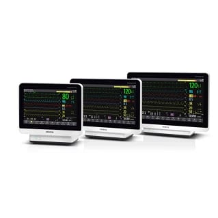 Three medical patient monitors displaying vital signs with green waveforms and digital readings on black screens