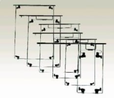 Set of nested rectangular wire frames in graduated sizes arranged at overlapping angles against a beige background