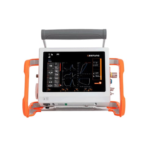 Portable medical ultrasound machine with orange carry handles and black display screen showing waveform readings